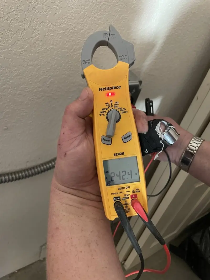Voltage testing with clamp meter during Outlet Installation in Chula Vista